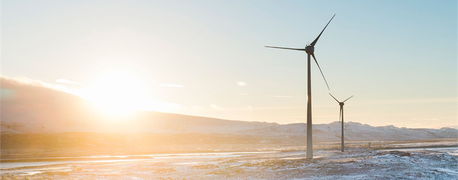 Wind turbines in a cold climate surrounded by ice